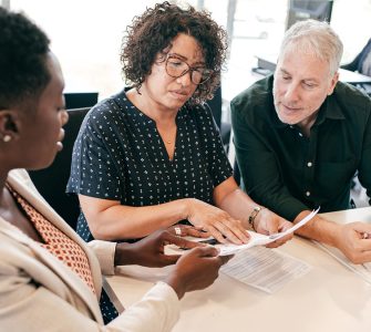 People discussing a recruiting contract